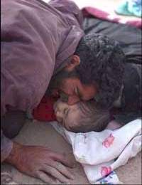 Father Mourning his dead baby in Bam Iran Quake
